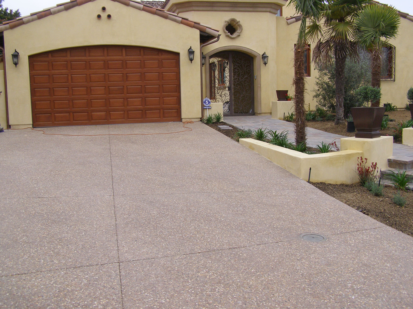 A Cement Chip Driveway Path Infront of a Garage