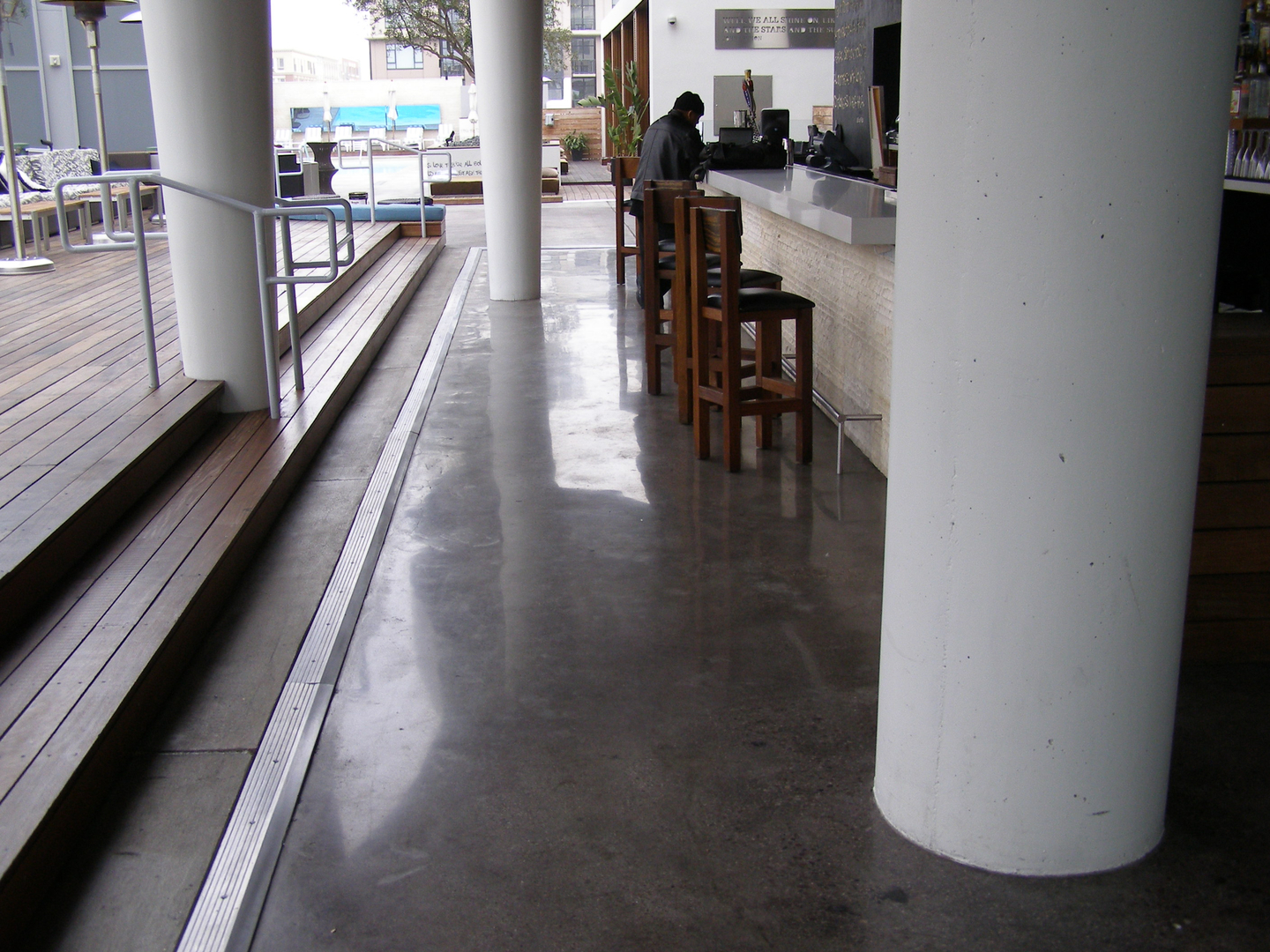 A Bar Space With Big White Pillars