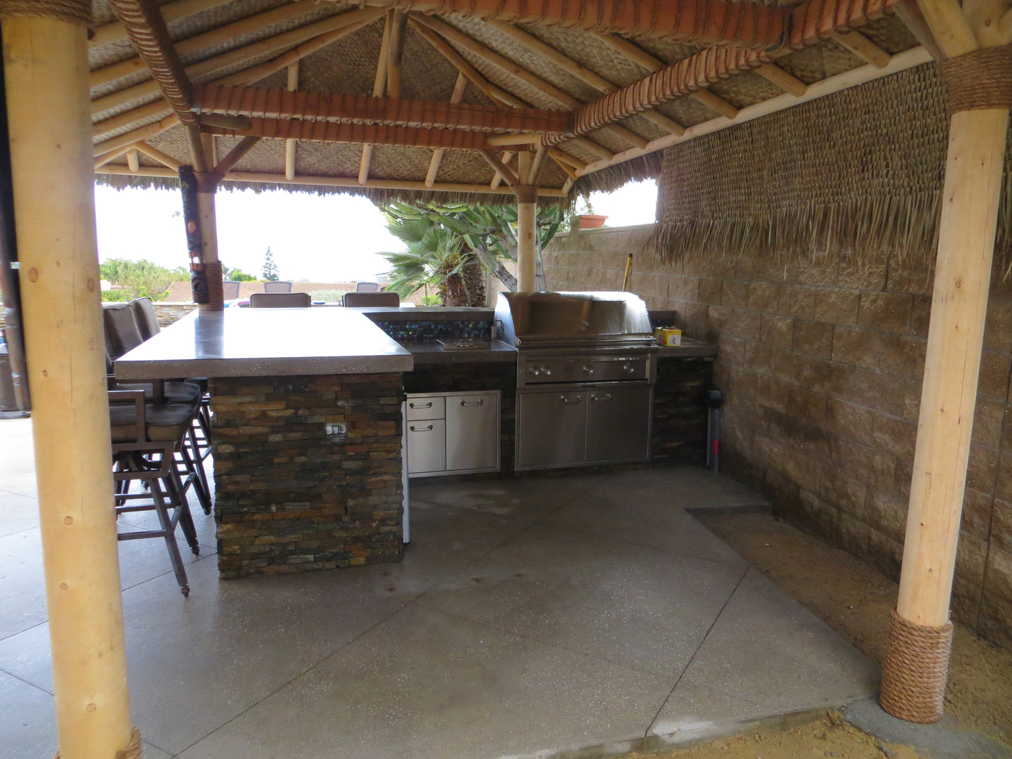 An Outdoor L Shaped Kitchen Space