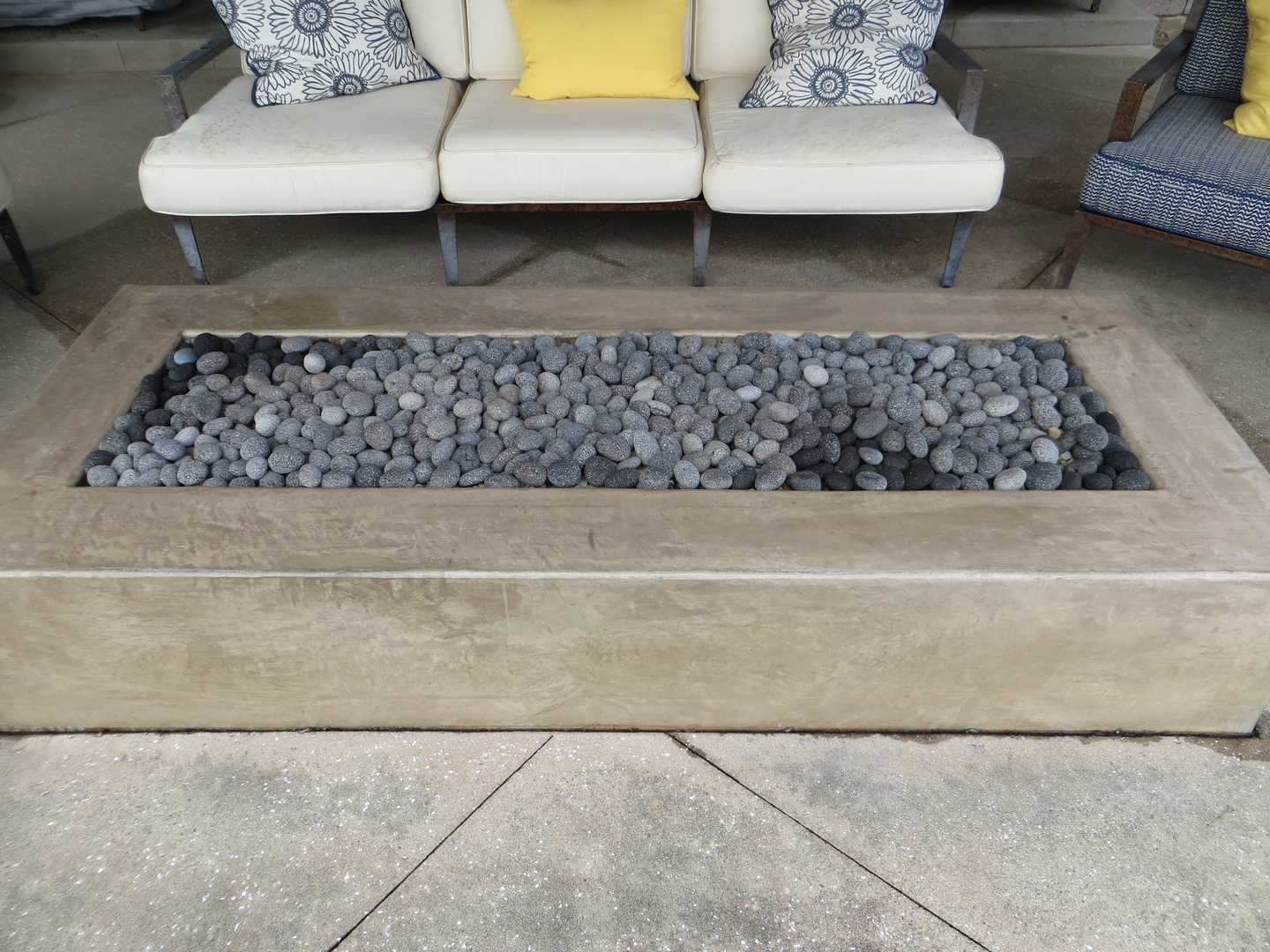 A Granite Fire Space With Grey Pebbles