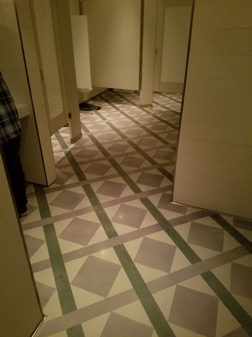 A Diamond Shaped Tiled Space for a Bathroom Stalls