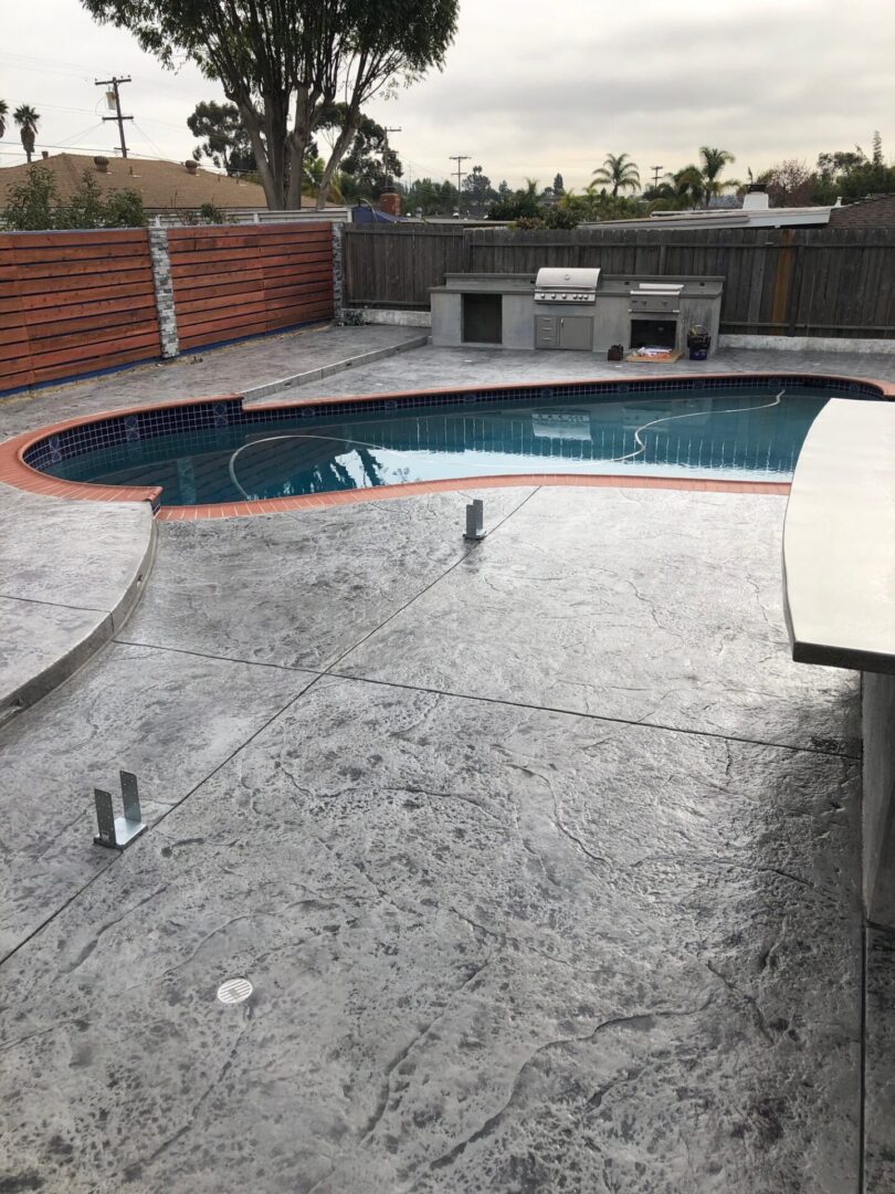 Close view of stamp concrete floor around the pool