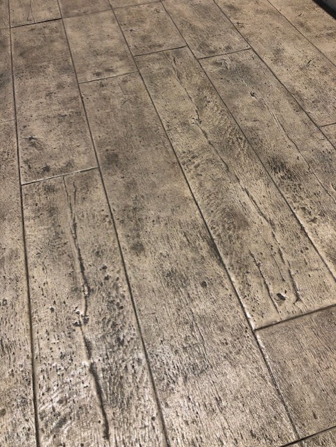 Close view of beige stamp concrete tiles floor